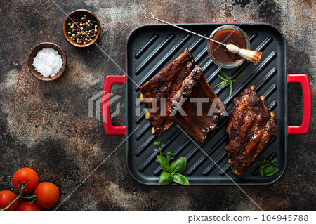 Grilled bbq ribs with sauce Grilled bbq ribs with sauce 104945788