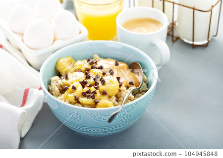 Oatmeal with caramelized bananas Oatmeal with caramelized bananas 104945848