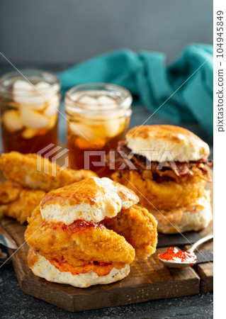 Breakfast biscuit sandwiches with fried chicken Breakfast biscuit sandwiches with fried chicken 104945849