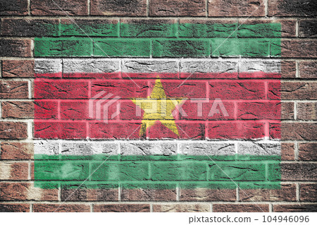 Suriname flag on a brick wall background 104946096
