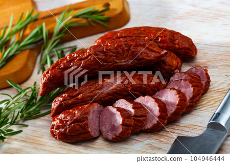 Czech dried sausages on wooden table Czech dried sausages on wooden table 104946444