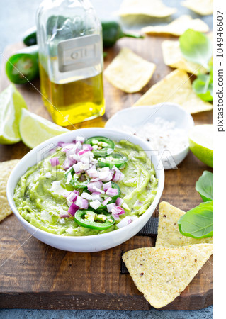 Guacamole with red onion and Jalapeno pepper 104946607