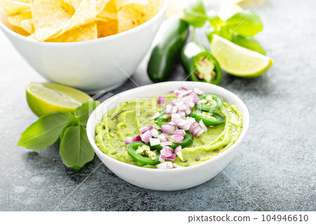Guacamole with red onion and Jalapeno pepper Guacamole with red onion and Jalapeno pepper 104946610