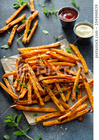 Sweet potato fries with sauces 104946639