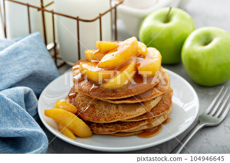 Pancakes with apple caramel topping 104946645