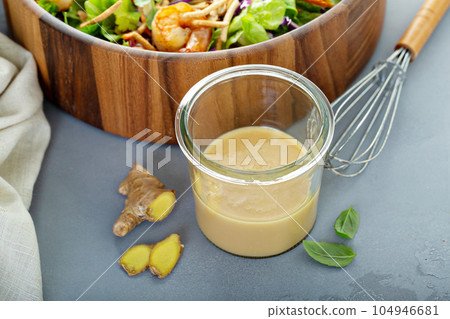 Ginger peanut asian salad dressing 104946681