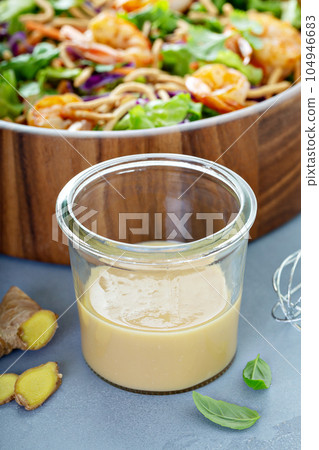 Ginger peanut asian salad dressing 104946683