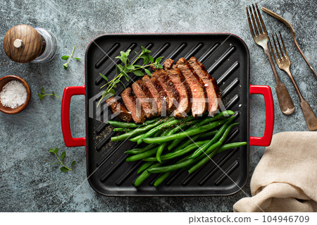 Grilled sirloin steak with asparagus Grilled sirloin steak with asparagus 104946709