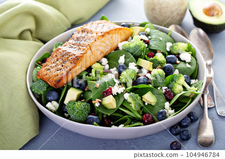 Fresh spinach and feta salad with salmon 104946784