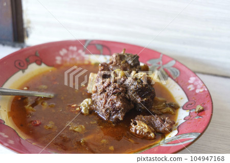 Gule Balungan Kambing Madura is a savory Indonesian dish that features Madurese style goat ribs stewed in a fragrant and flavorful curry like broth. 104947168
