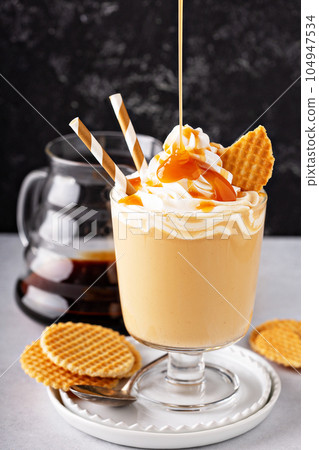 Caramel coffee latte in a dessert glass Caramel coffee latte in a dessert glass 104947534
