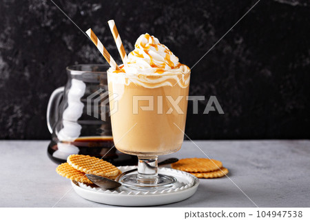 Caramel coffee latte in a dessert glass Caramel coffee latte in a dessert glass 104947538