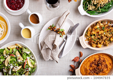 Thanksgiving dinner with whole turkey and sides Thanksgiving dinner with whole turkey and sides 104947835