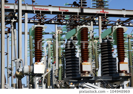 High voltage tower. High voltage. Electricity transmission power lines at sunset (high voltage pylon). High voltage circuit breaker in a power substation. Aerial view of high voltage power lines. High voltage tower. High voltage. Electricity transmission power lines at sunset (high voltage pylon). High voltage circuit breaker in a power substation. Aerial view of high voltage power lines. 104948969