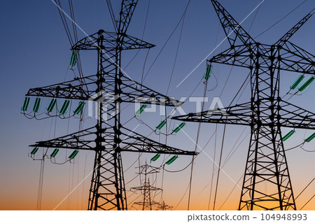 High voltage tower. High voltage. Electricity transmission power lines at sunset (high voltage pylon). High voltage circuit breaker in a power substation. Aerial view of high voltage power lines. High voltage tower. High voltage. Electricity transmission power lines at sunset (high voltage pylon). High voltage circuit breaker in a power substation. Aerial view of high voltage power lines. 104948993