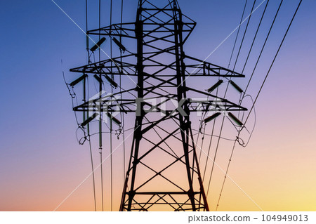 High voltage tower. High voltage. Electricity transmission power lines at sunset (high voltage pylon). High voltage circuit breaker in a power substation. Aerial view of high voltage power lines. High voltage tower. High voltage. Electricity transmission power lines at sunset (high voltage pylon). High voltage circuit breaker in a power substation. Aerial view of high voltage power lines. 104949013