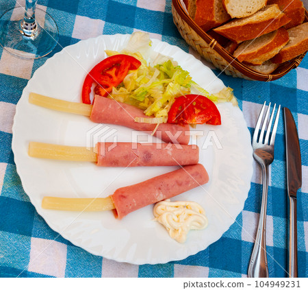 Ham rolls with asparagus mayonnaise and salad 104949231