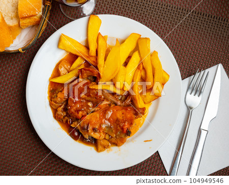 Dish of stewed rabbit and potatoes Dish of stewed rabbit and potatoes 104949546