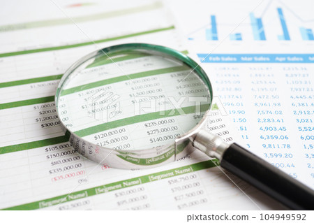 Magnifying glass on charts graphs paper. Financial development, Banking Account, Statistics, Investment Analytic research data economy. 104949592