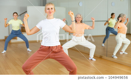 Woman dancing during group class 104949656