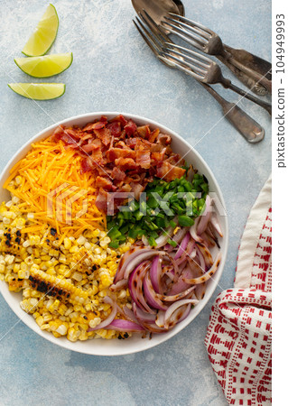 Grilled corn and jalapeno salad with cheese and bacon 104949993