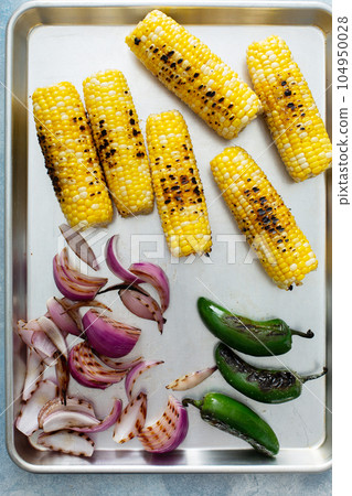 Grilled vegetables on a metal tray 104950028