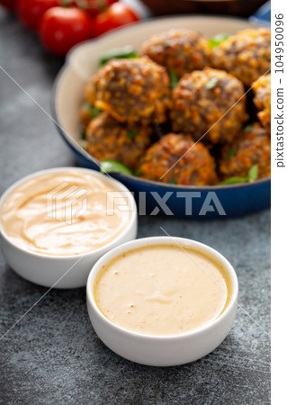 Sauasage balls with cheese and sauce Sauasage balls with cheese and sauce 104950096