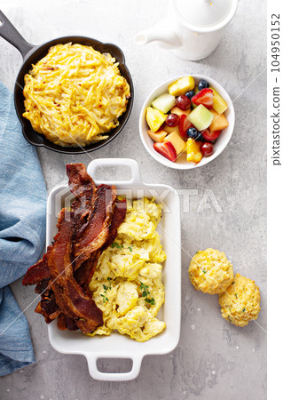 Full breakfast with scrambled eggs, bacon and potatoes Full breakfast with scrambled eggs, bacon and potatoes 104950152