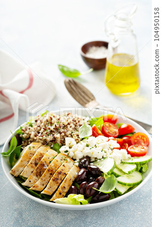 Greek inspired lunch bowl with chicken and quinoa 104950158