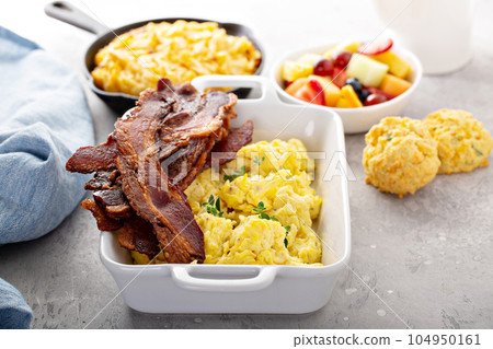 Full breakfast with scrambled eggs, bacon and potatoes Full breakfast with scrambled eggs, bacon and potatoes 104950161