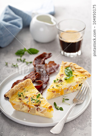 Breakfast plate with bacon and potato quiche 104950175