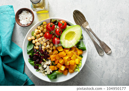 Vegan lunch bowl with chickpeas and roasted squash 104950177