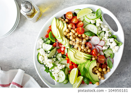 Healthy vegetarian salad with chickpeas, avocado and feta Healthy vegetarian salad with chickpeas, avocado and feta 104950181