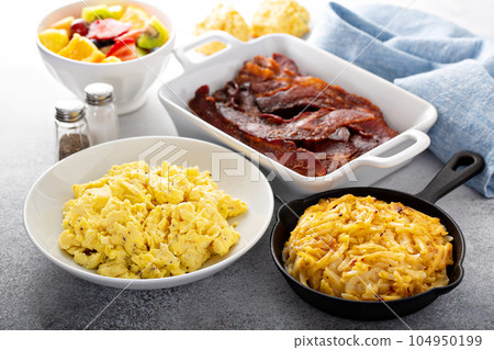 Full breakfast with scrambled eggs, bacon and potatoes Full breakfast with scrambled eggs, bacon and potatoes 104950199