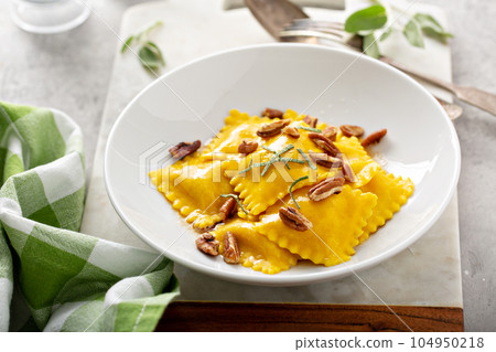 Butternut squash tortellini with brown butter and pecans 104950218
