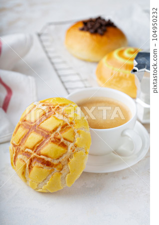 Variety of breakfast buns with coffee Variety of breakfast buns with coffee 104950232