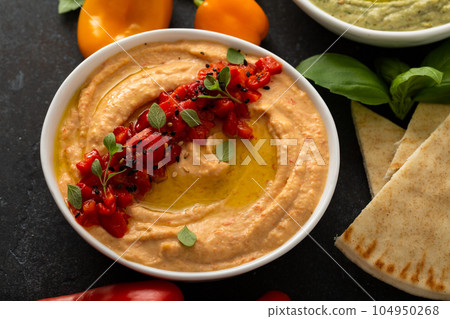 Roasted pepper hummus with pita Roasted pepper hummus with pita 104950268