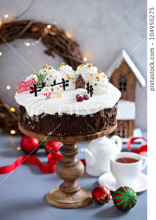 Christmas cake decorated with winter scene 104950275