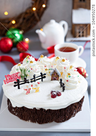 Christmas cake decorated with winter scene 104950278