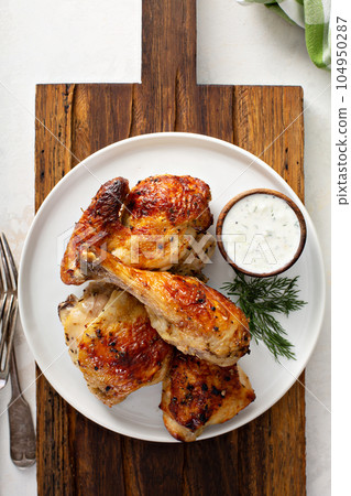 Roasted chicken with tzatziki sauce Roasted chicken with tzatziki sauce 104950287
