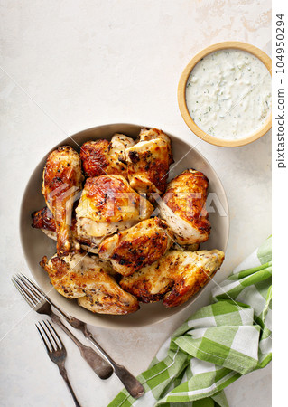 Roasted chicken with tzatziki sauce 104950294