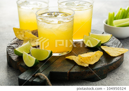 Margaritas served in salt rimmed glasses 104950324