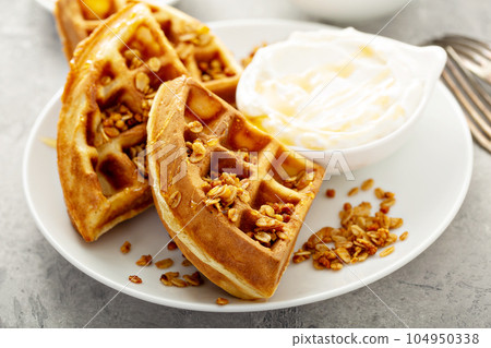 Breakfast waffles with yogurt and granola 104950338