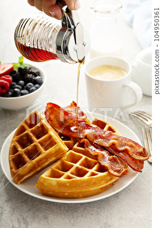 Breakfast plate with waffles and bacon 104950361