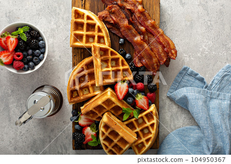 Breakfast platter with waffles, berries and bacon Breakfast platter with waffles, berries and bacon 104950367