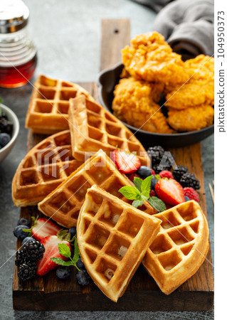 Breakfast platter with waffles, berries and chicken Breakfast platter with waffles, berries and chicken 104950373