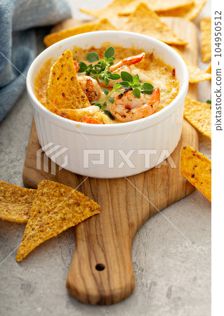 Spicy seafood dip in a ramekin 104950512