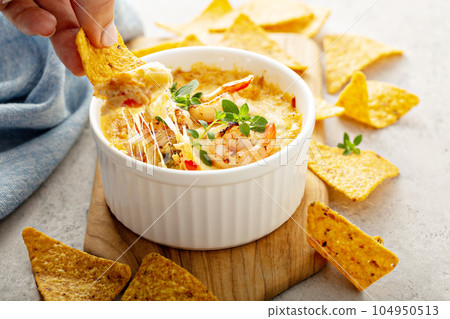 Spicy seafood dip in a ramekin 104950513