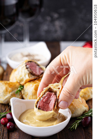 Bite size Beef Wellingtons 104950618