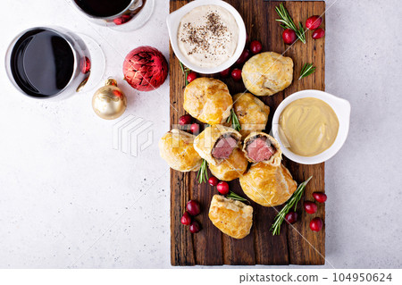 Bite size Beef Wellingtons 104950624